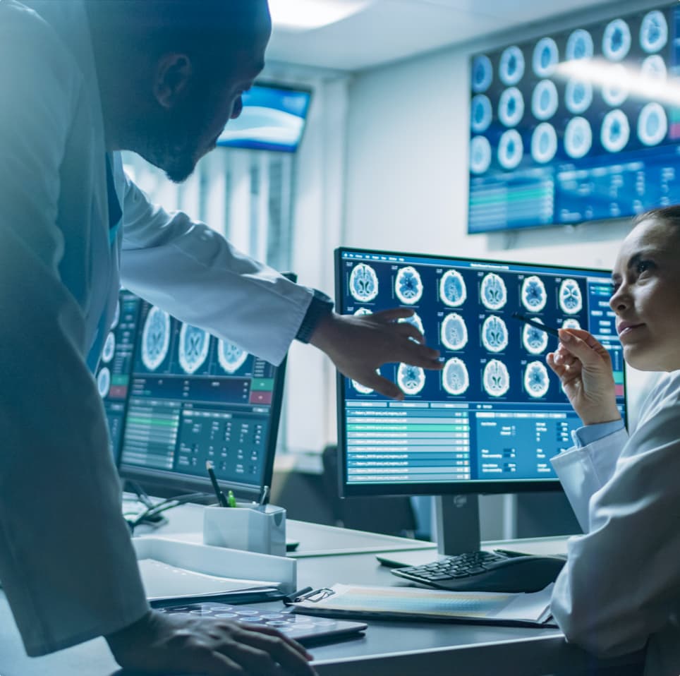 Healthcare professionals comparing while watching brain’s scans for a diagnosis